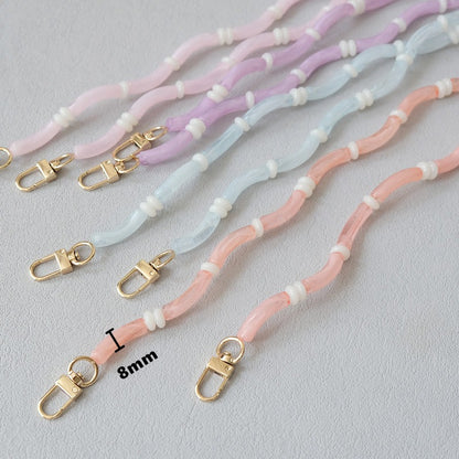 Smooth Moves PHONE CHAIN shown in pink, lavender, blue, and coral tube-bead colorways with gold clasps and an 8mm size label.