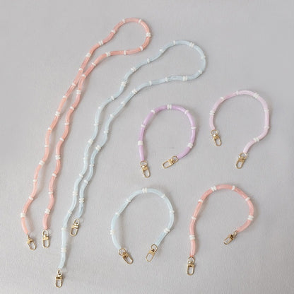 Six Smooth Moves PHONE CHAIN bracelet-length segments in pink, blue, lavender, and coral tube-bead colorways.