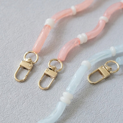 Close-up of pink and light blue Smooth Moves PHONE CHAIN clasps and beaded tube segments.