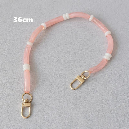 Pink Smooth Moves PHONE CHAIN, 36cm bracelet length, with gold clasps and white spacer beads.