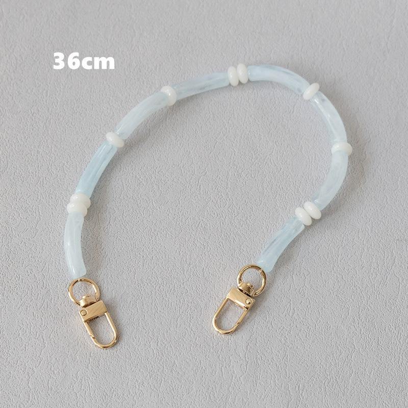 Light blue Smooth Moves PHONE CHAIN, 36cm bracelet length, with gold clasps and white spacer beads.