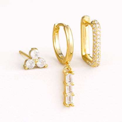 The Solaire SET includes three gold pieces: a trio stud, a huggie with baguette drop, and a pave rectangle hoop.