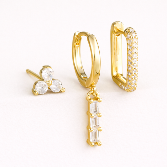 The Solaire SET includes three gold pieces: a trio stud, a huggie with baguette drop, and a pave rectangle hoop.