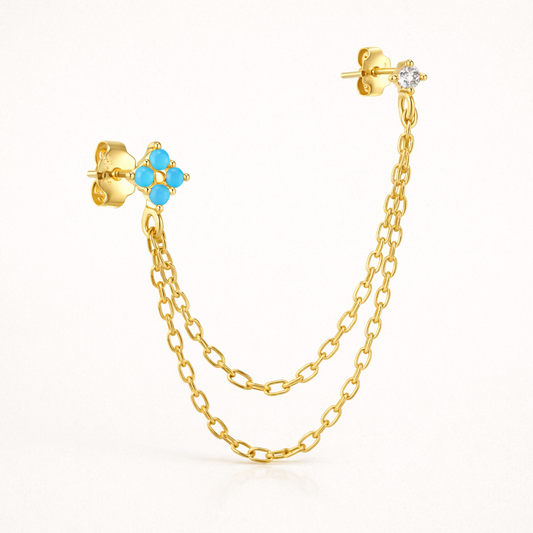 Sonoma Set in gold, a turquoise flower stud and a clear crystal stud connected by a delicate draped double chain.
