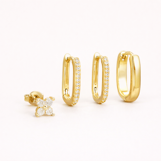 Sophia Set of four gold pieces: a clover stud and three rectangular hoops, two lined with white crystals and one smooth polished.