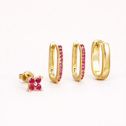 Sophia Set in gold with pink crystal accents, showing the same clover stud and crystal-lined rectangular hoop trio.