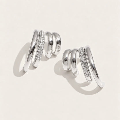 Silver-tone Strata EARRINGS: a pair of earrings with three wavy layers, one row set with pavé white zirconia — Folie à Trois