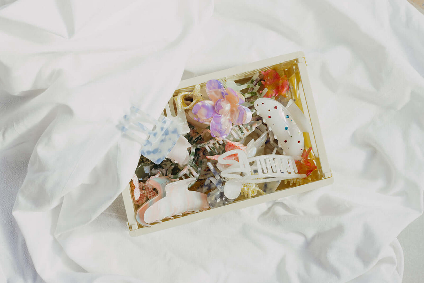 Summer Bliss HAIR CLIP shown packed into a gift box alongside an assortment of other differently shaped hair clips.