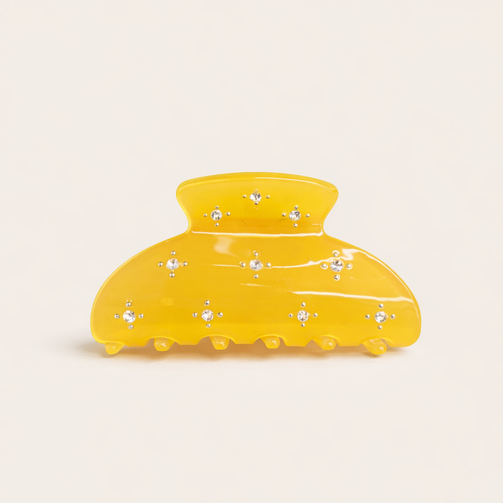 Summer Bliss HAIR CLIP large acetate claw clip in solid yellow with crystal star accents, studio shot.