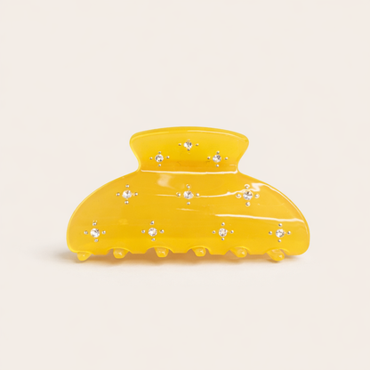 Summer Bliss HAIR CLIP large acetate claw clip in solid yellow with crystal star accents, studio shot.