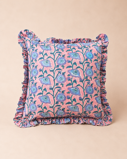 Pink square cushion with a blue floral vine block-print pattern and ruffled trim, the Taj Pink Square Cushion on a neutral background.