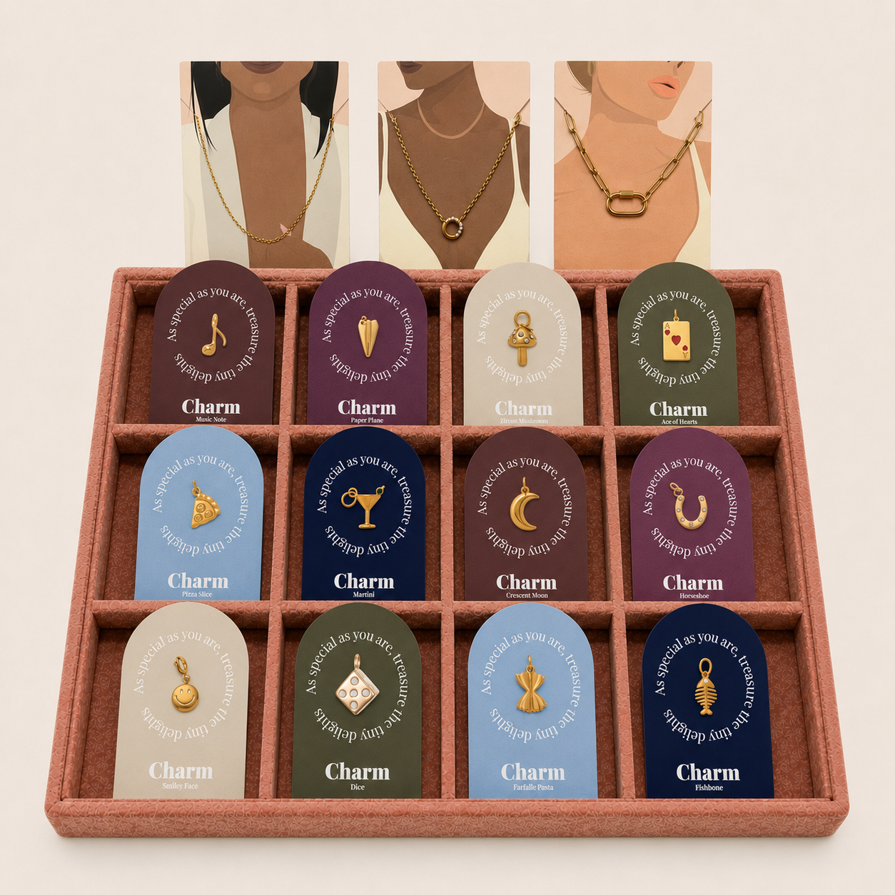The Signature Charms BUNDLE tray shown beneath three illustrated cards of models wearing gold necklaces in different chain styles.