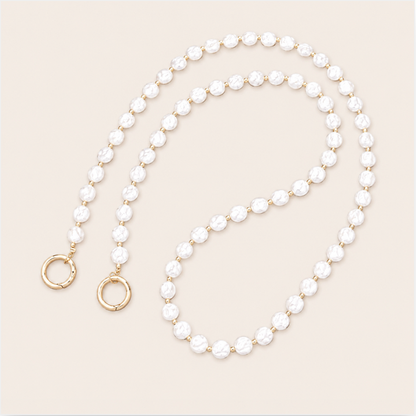 Thistle Pearl Phone Chain detail, luxury packshot on beige background