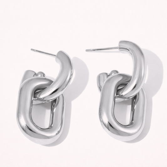 Tilda Earrings in polished silver, an interlocking chunky chain-link design formed by two bold linked oval hoops.