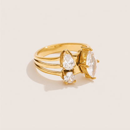 Gold split-band ring clustering a large marquise white zirconia with a pear and round stone — Folie à Trois Trio Halo RING