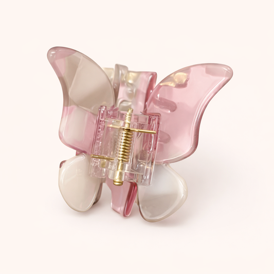 Pink and white layered acetate butterfly-shaped claw clip from the True Paradise HAIR CLIP collection.