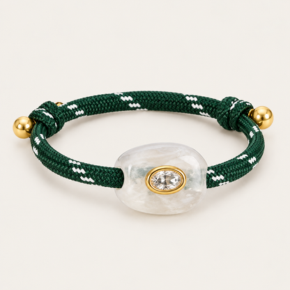 Truffle BRACELET in green and clear: forest green rope cord with a milky white stone and oval gold-set crystal, adjustable fit