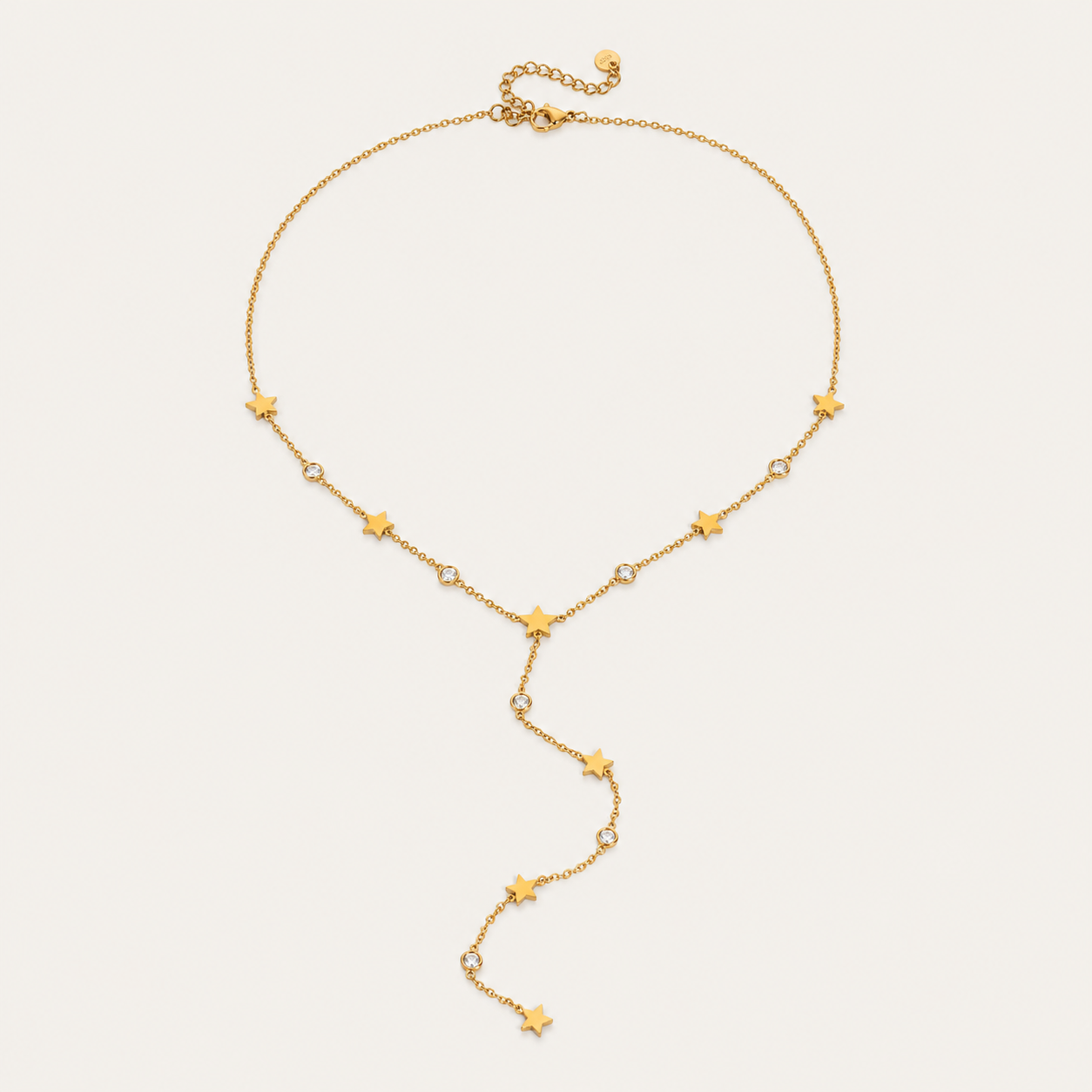 Gold Vagabonde Y NECKLACE with star and crystal stations and an adjustable clasp, shown fastened in a circle on a white background.