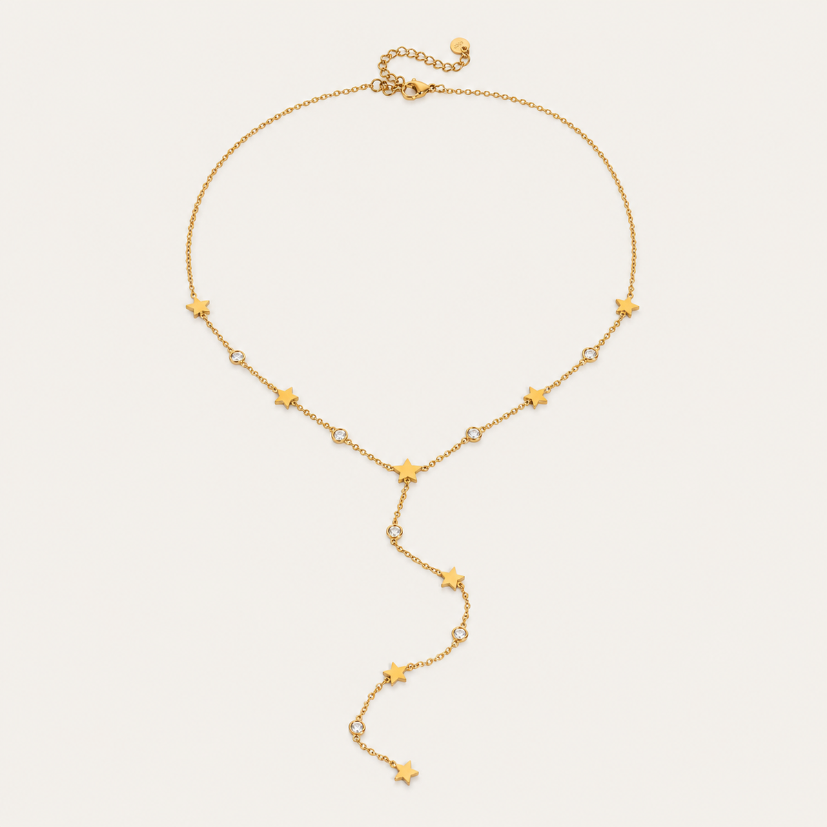 Gold Vagabonde Y NECKLACE with star and crystal stations and an adjustable clasp, shown fastened in a circle on a white background.