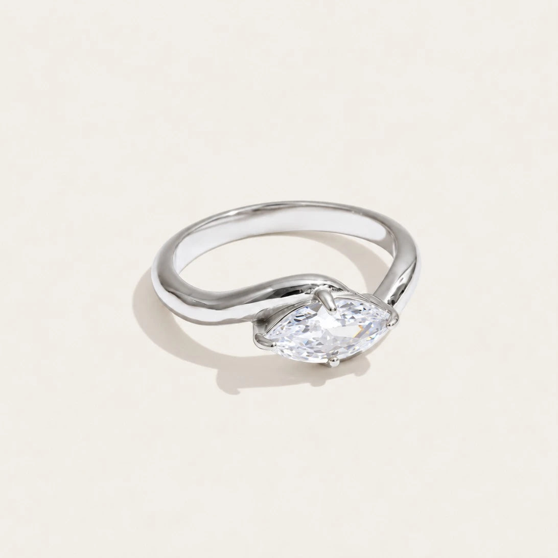 Silver-tone Vague RING: a broad, undulating wave band with a white zirconia set in the curve — Folie à Trois