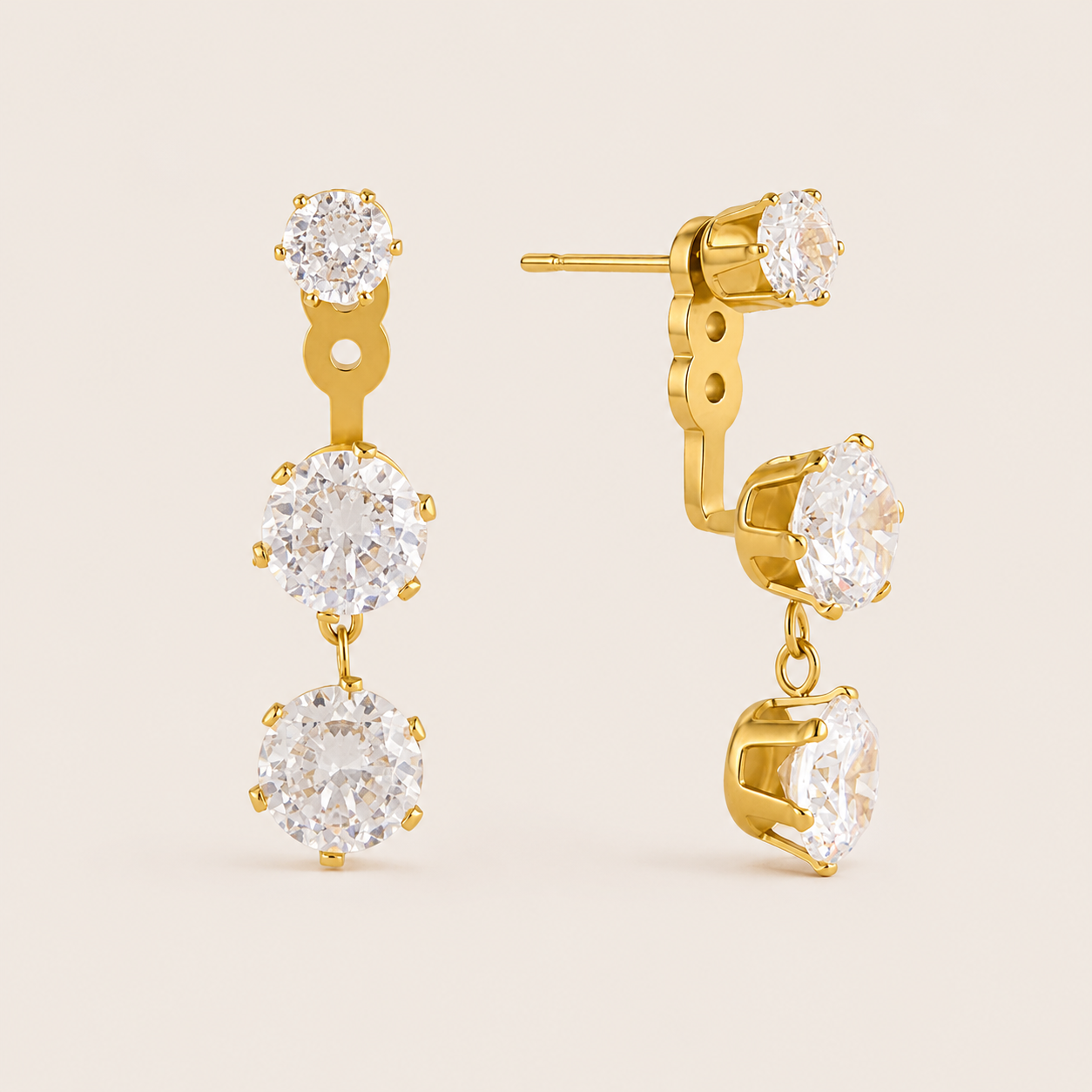 Gold Vega EARRINGS drops with three graduated round cubic zirconia stones in a vertical line, largest at the bottom.