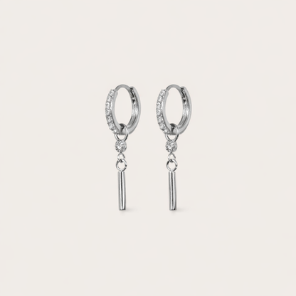 Vibrant Hues Earrings pair a pave hoop with a dangling stick charm below a small clear stone, in silver tone.