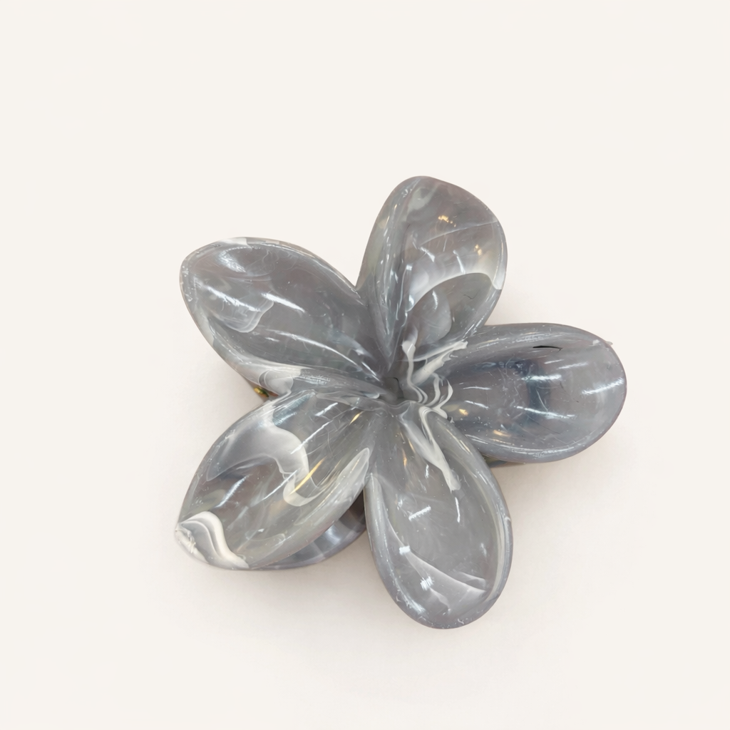 Virelle HAIR CLIP flower-shaped acetate claw clip in a grey and white marbled pattern, studio shot.