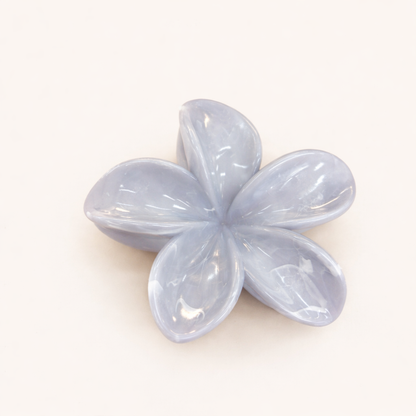 Virelle HAIR CLIP flower-shaped acetate claw clip in a pale periwinkle blue-grey shade, studio shot.