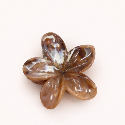 Virelle HAIR CLIP flower-shaped acetate claw clip in a brown and tan marbled pattern, studio shot.