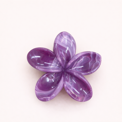 Virelle HAIR CLIP flower-shaped acetate claw clip in a deep violet marbled pattern, studio shot.
