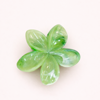 Virelle HAIR CLIP flower-shaped acetate claw clip in a yellow-green marbled pattern, studio shot.