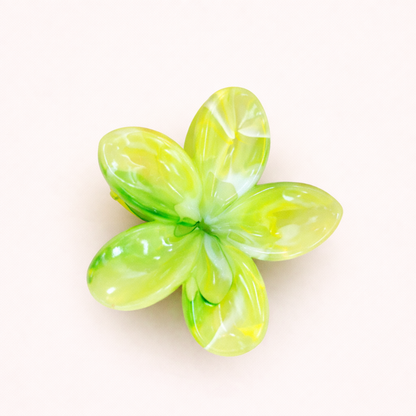 Virelle HAIR CLIP flower-shaped acetate claw clip in a bright lime green marbled pattern, studio shot.