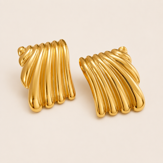 Gold Wanna be Mine EARRINGS studs with a fluted, fan-shaped ribbed design and a smooth polished finish.