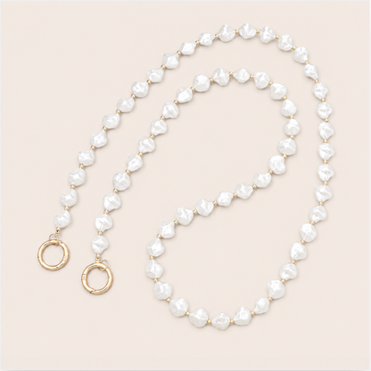 Winslow Pearl Phone Chain - irregular baroque pearl bead chain, luxury packshot on beige background
