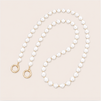 Winslow Pearl Phone Chain detail, luxury packshot on beige background