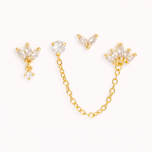 The Yvette SET includes four gold pieces: a leaf-cluster stud with drop, a chain stud, and a petal charm.