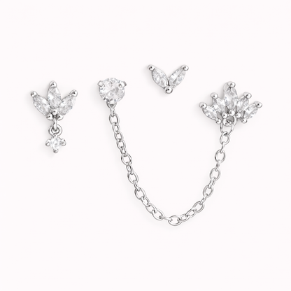 The Yvette SET is shown in silver: a leaf-cluster stud with drop, a chain stud, and a small petal charm.