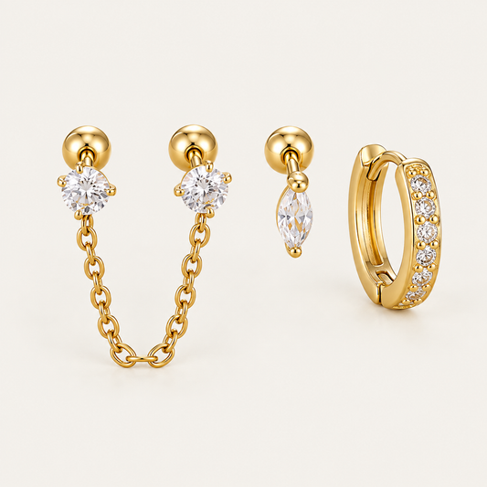 Three gold Folie à Trois Zélie SET pieces: a chain-linked double stud, a marquise drop stud and a pavé huggie hoop.