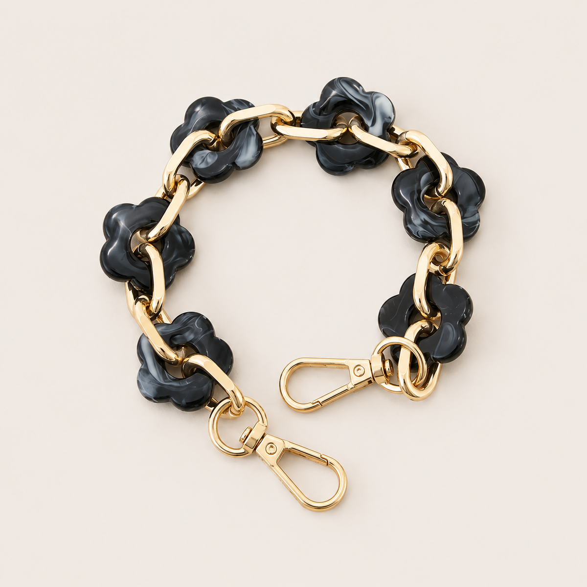 Round flower-link phone chain in charcoal marbled acrylic with gold chain links — Folie à Trois Zinnia wholesale phone chain