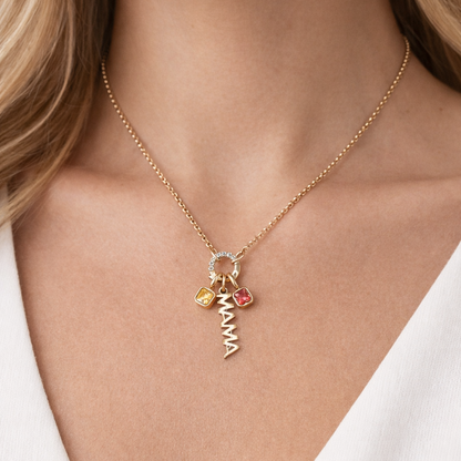 The Zircon Charm NECKLACE worn with a gold MAMA script charm and yellow and pink square gemstone charms at the neckline.