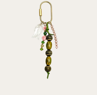 Pescado BAG CHARM Ivory Fish - white enamel fish charm with green and pink beads