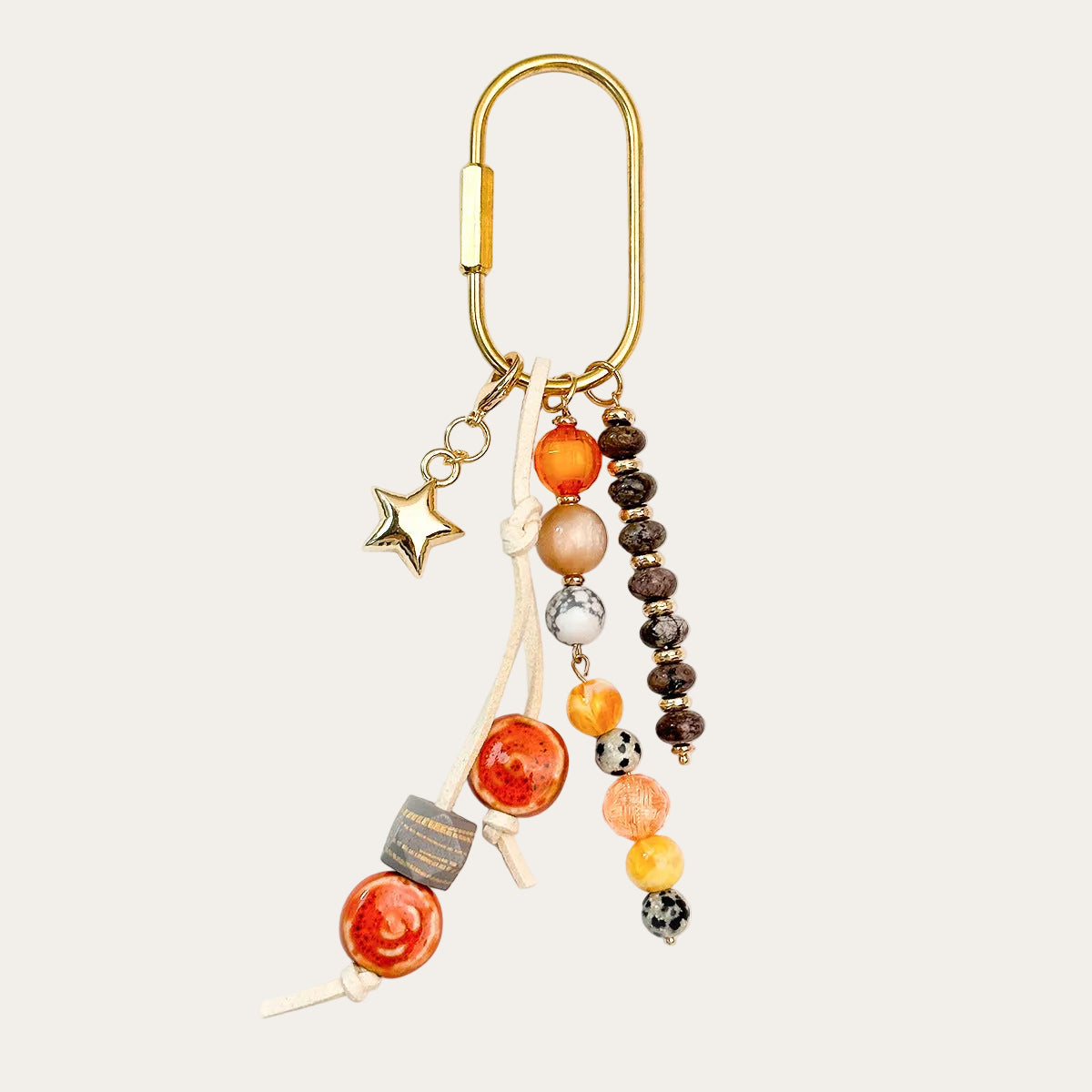 Bahia BAG CHARM Sunset - orange and brown beaded tassel with star charm