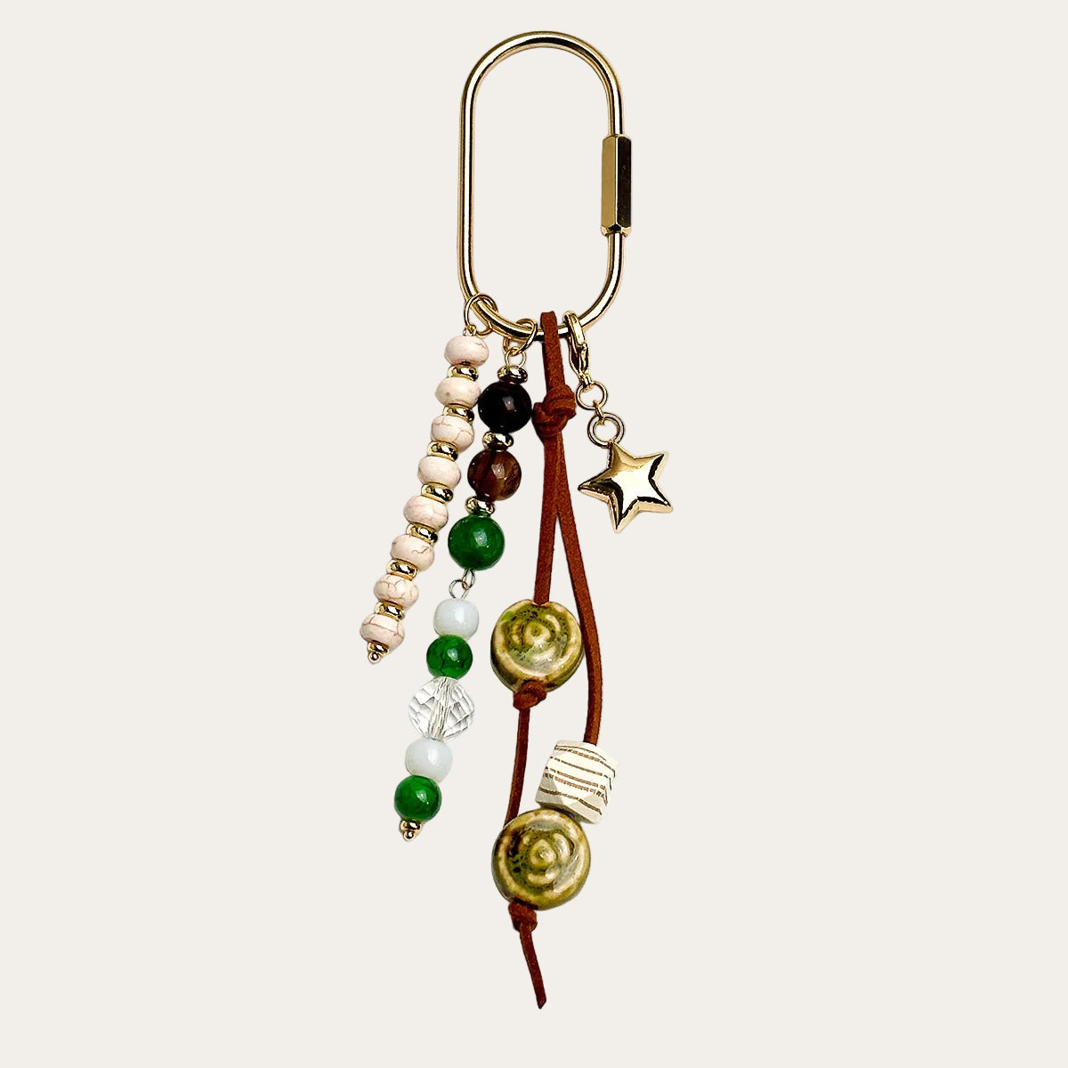 Bahia BAG CHARM Forest - green and brown beaded tassel with star charm