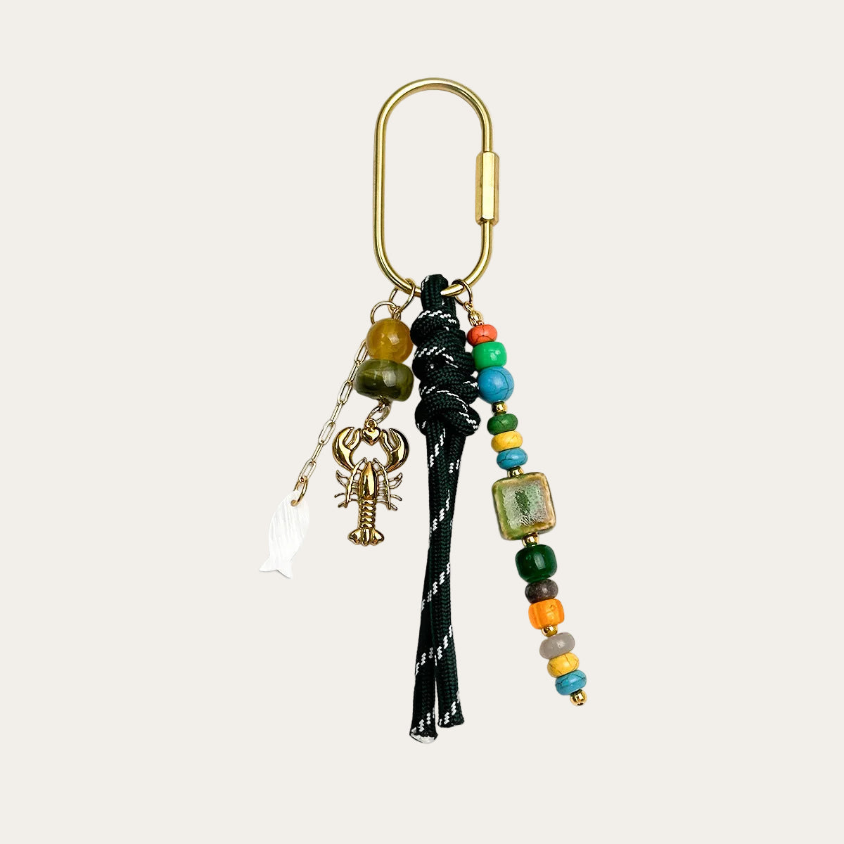Marisol BAG CHARM Emerald Lobster - dark green woven cord with colorful beads and gold lobster charm