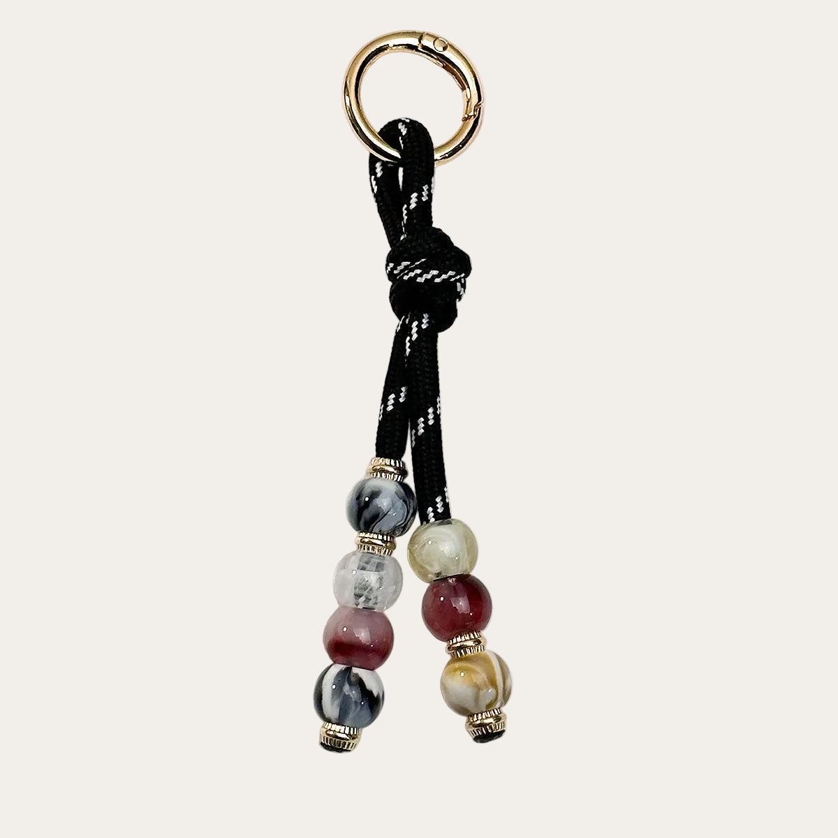 Nodo BAG CHARM Onyx - black paracord with grey and burgundy beads