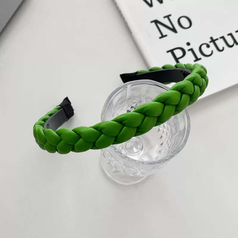 Green braided headband styled on a glass tumbler, from a generic headband catalog set.