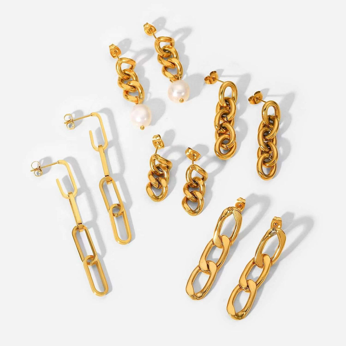 Lotte Earrings lineup shows five gold chain styles, including a paperclip-link pair and one with pearl drops.