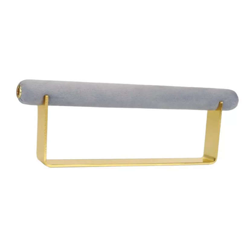 Velvet Ring DISPLAY stand in gold with a soft blue-grey velvet bar, shown empty at an angle against a white background.