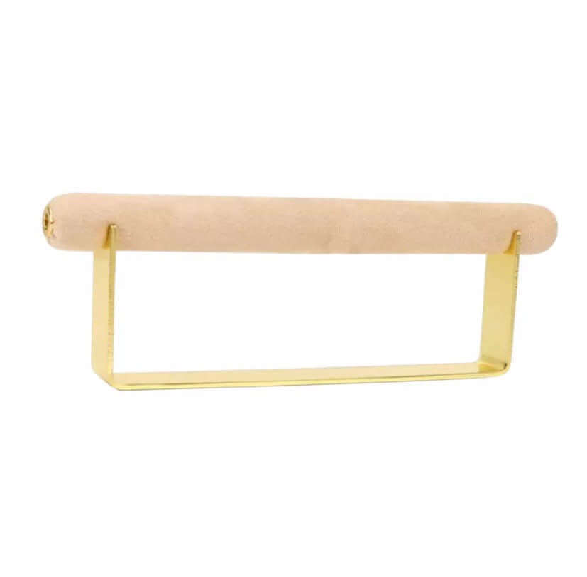 Velvet Ring DISPLAY stand in gold with a pale nude velvet bar, shown empty at an angle against a white background.
