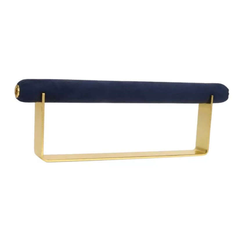 Velvet Ring DISPLAY stand in gold with a navy velvet bar, shown empty at an angle against a white background.